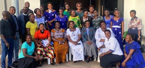 Reverend Barbara with the trainers and local facilitators at a facilitator training session.